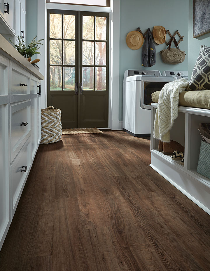 Luxury vinyl tile in dark brown wood, Sausalito Sunrise, look in mud room