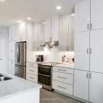 kitchen design with white cabinetry and quartz countertops