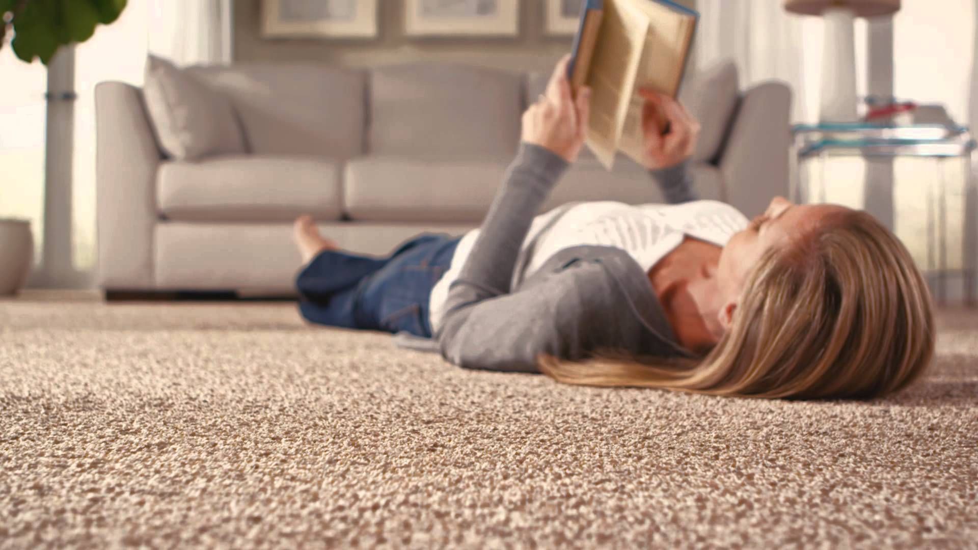 Textured beige luxury carpet flooring in a living room