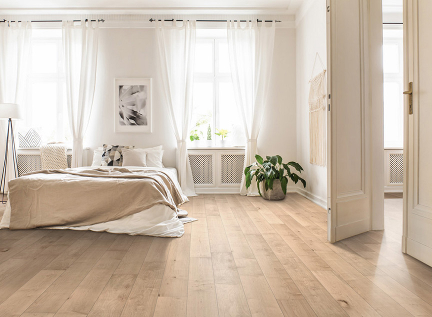 Light oak hardwood floors in a bedroom