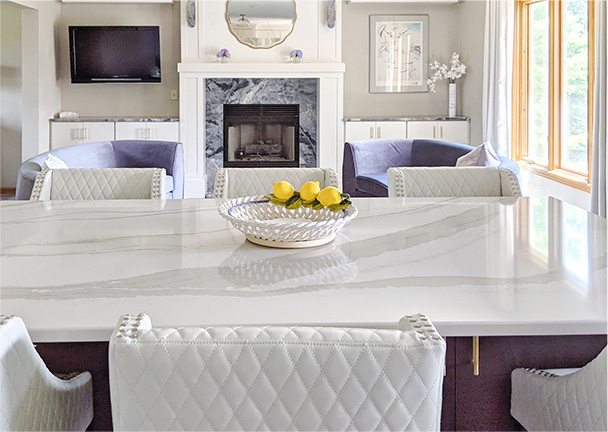 White quartz countertops with soft grey veining on kitchen island
