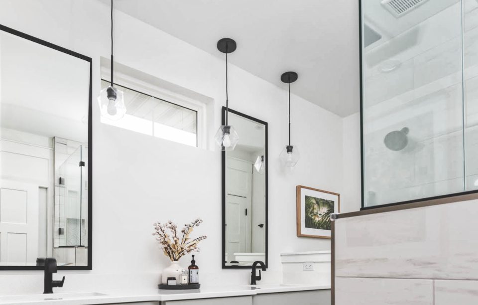 matte black glass ball pendant lighting in a bathroom design