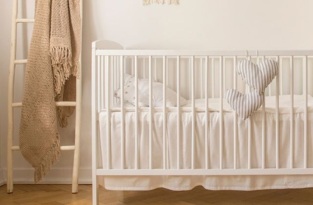 white painted baby crib