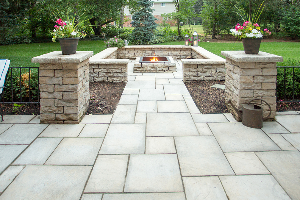 Paving brick patio with fire pit and landscape walls