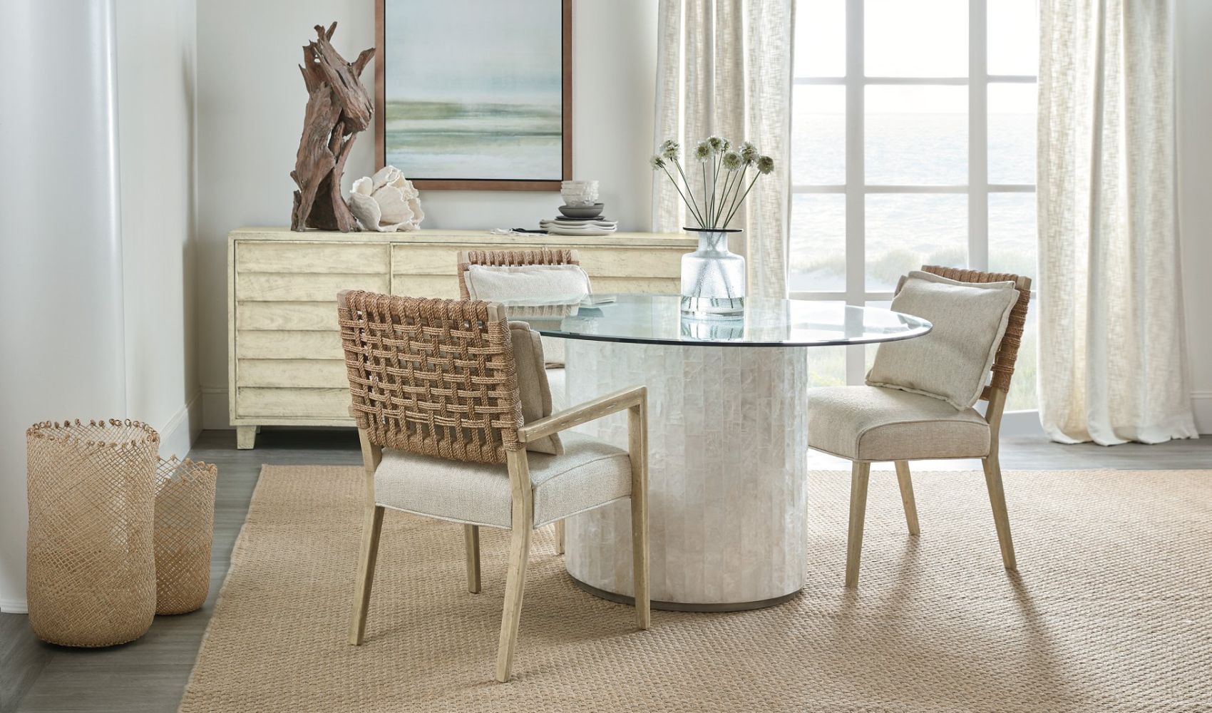 hooker pedestal table and natural wicker chairs