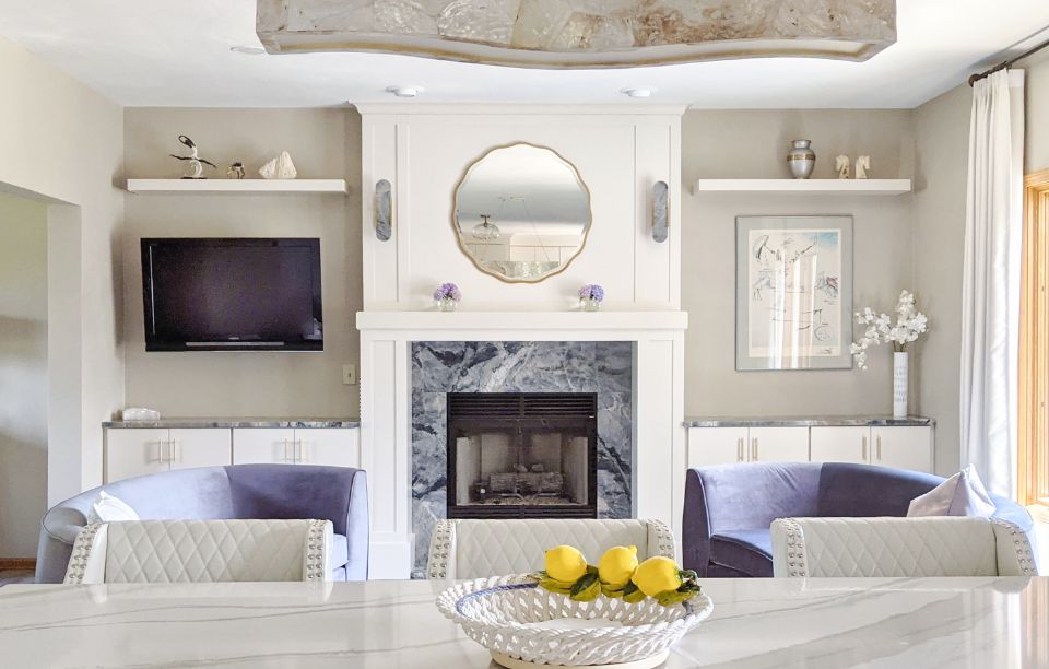 blue granite fireplace with a white mantel