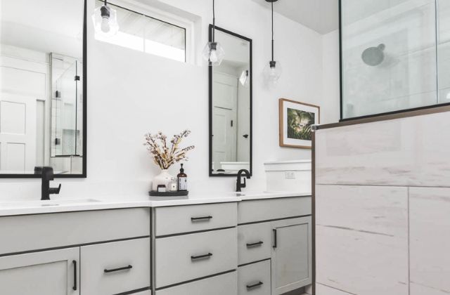 grey bathroom design with double vanity and tile