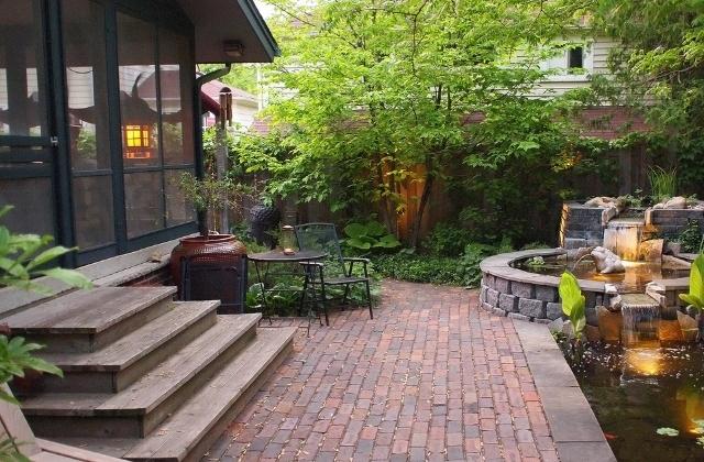 home patio with paving brick and pond