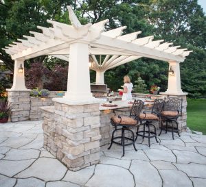 home landscape project with outdoor stone patio with pergola