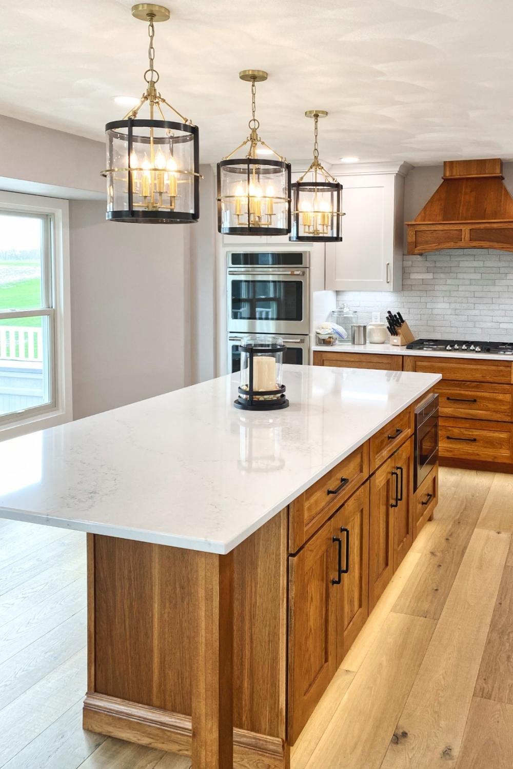 kitchen remodel with gold pendant lighting and hardwood floors