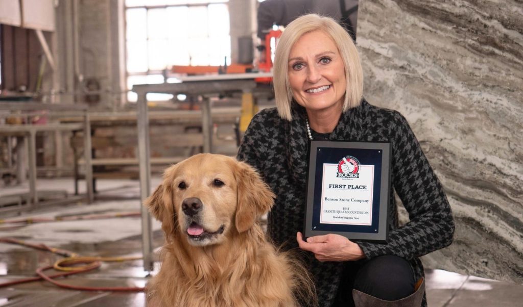 kim and benny benson with what rocks first place plaque