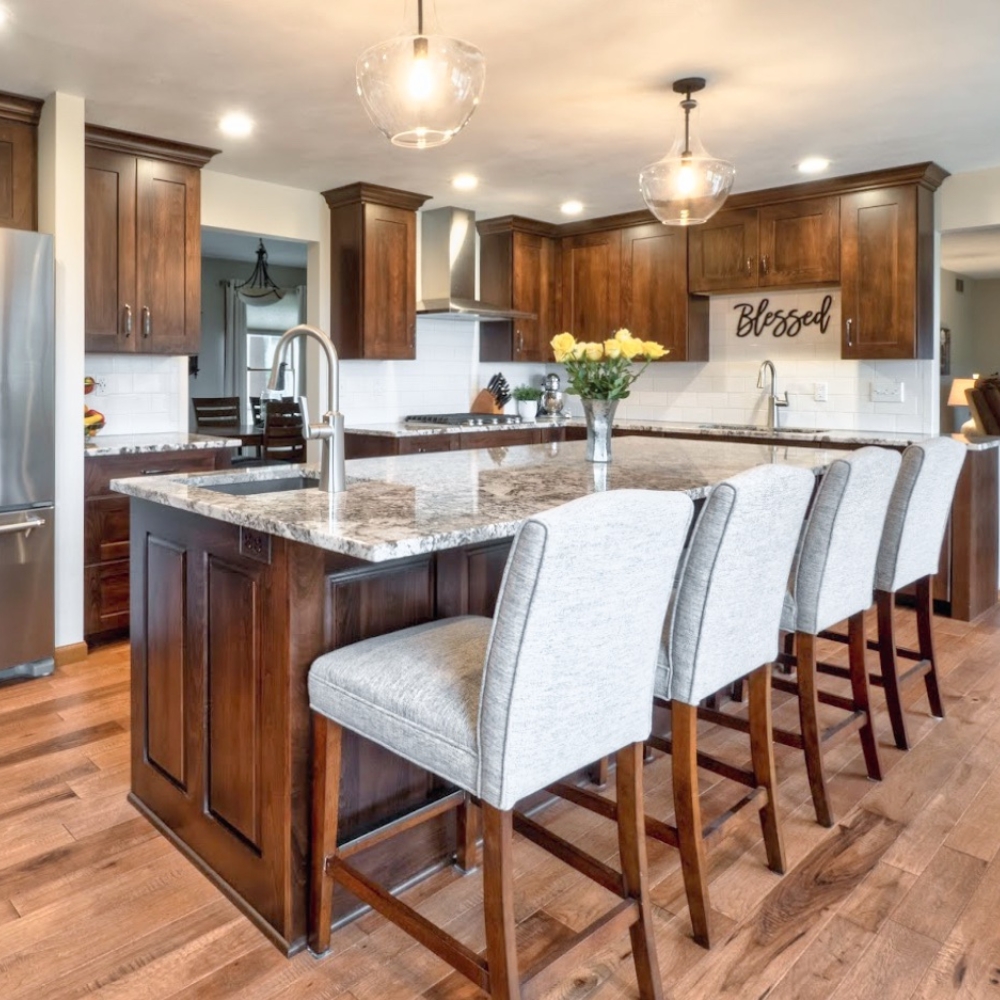 stained wood island with beige granite countertop kitchen design