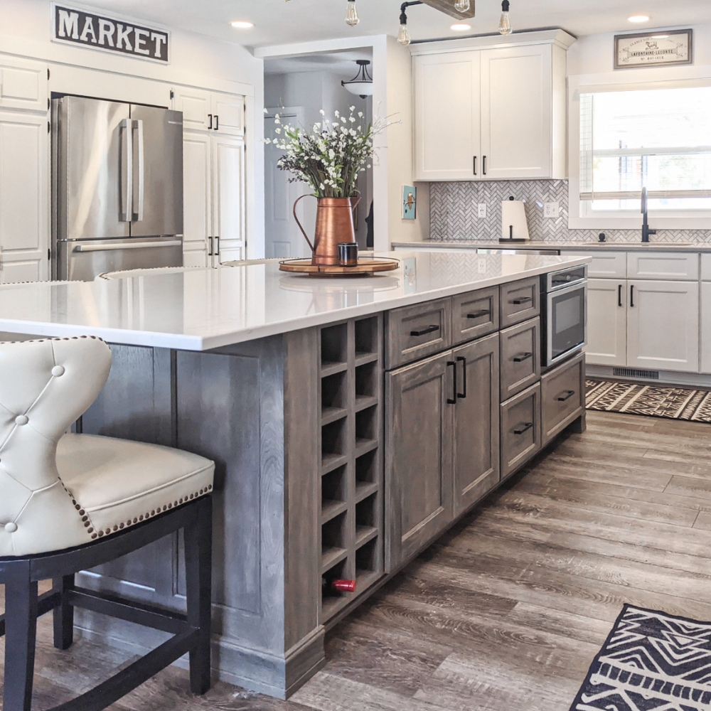 weathered grey kitchen island cabinet with white quartz countertop