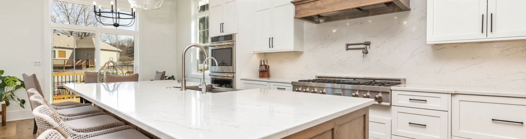 white quartz kitchen remodel with island by benson stone co