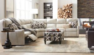 living room with white leather sectional, three-sided fireplace
