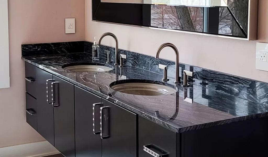 jet black stone countertop on a floating double vanity 