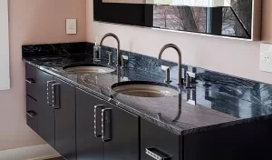 jet black stone countertop on a floating double vanity