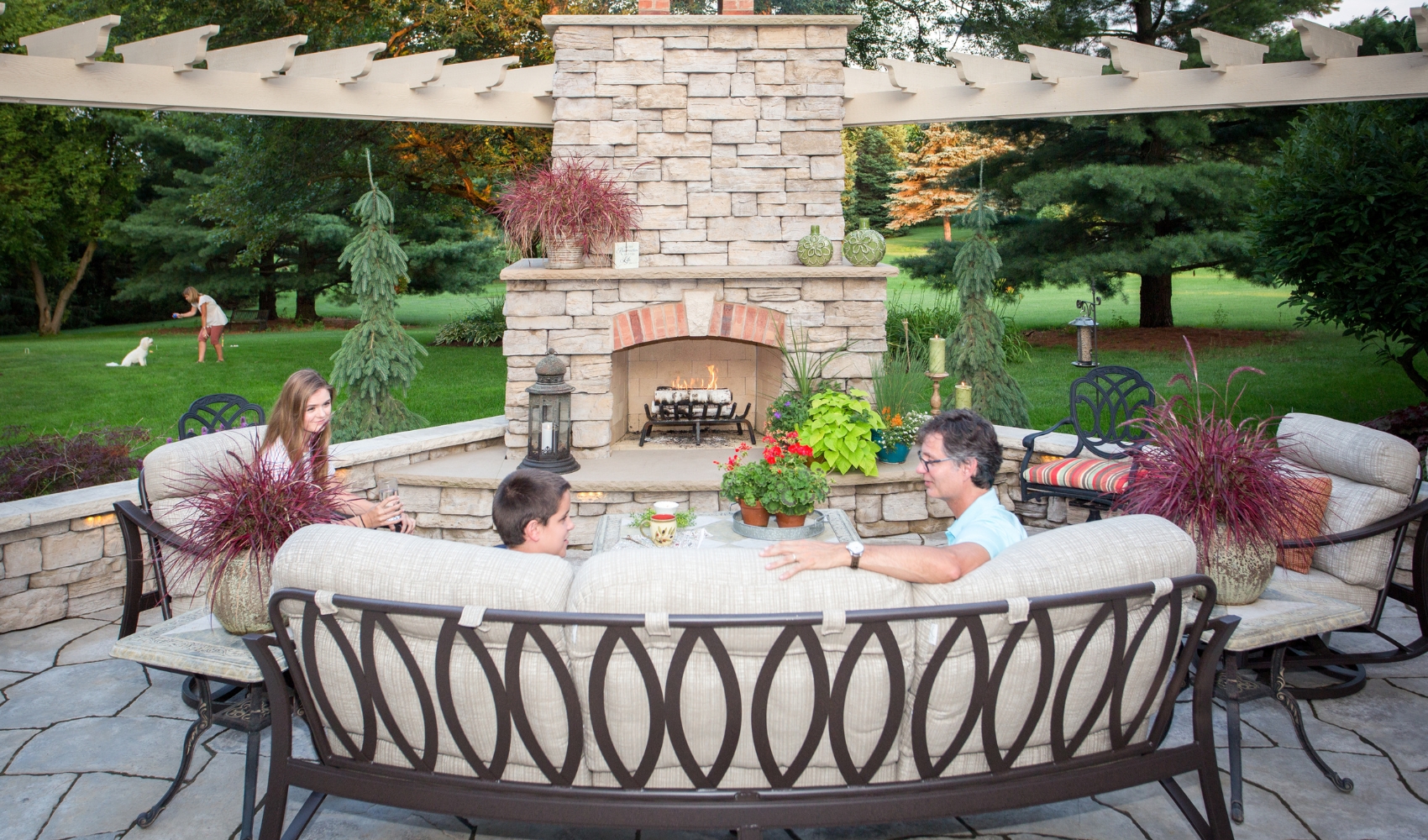 custom outdoor living project with fireplace and flagstone patio with products from benson stone company
