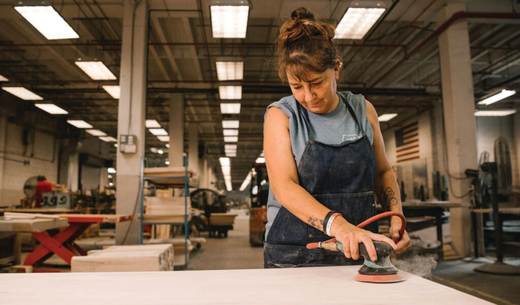 woman handcrafting american-made furniture 