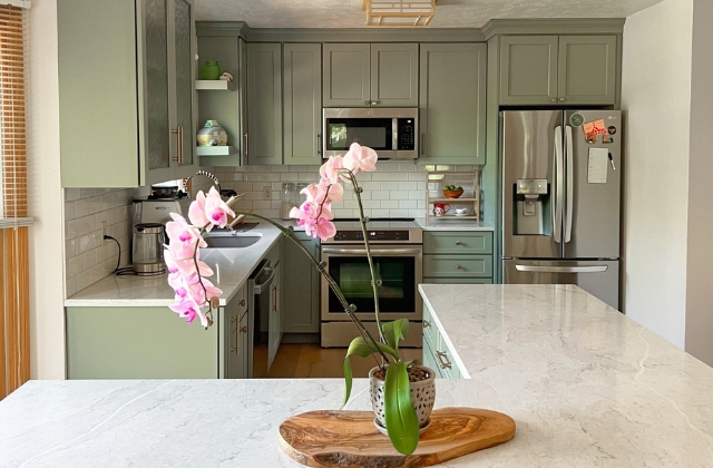 custom kitchen design featuring evergreen fog painted cabinetry from benson stone company in rockford, IL