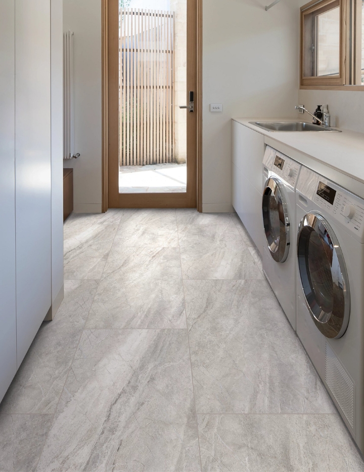 COREtec graphite travertine tile flooring in a laundry room