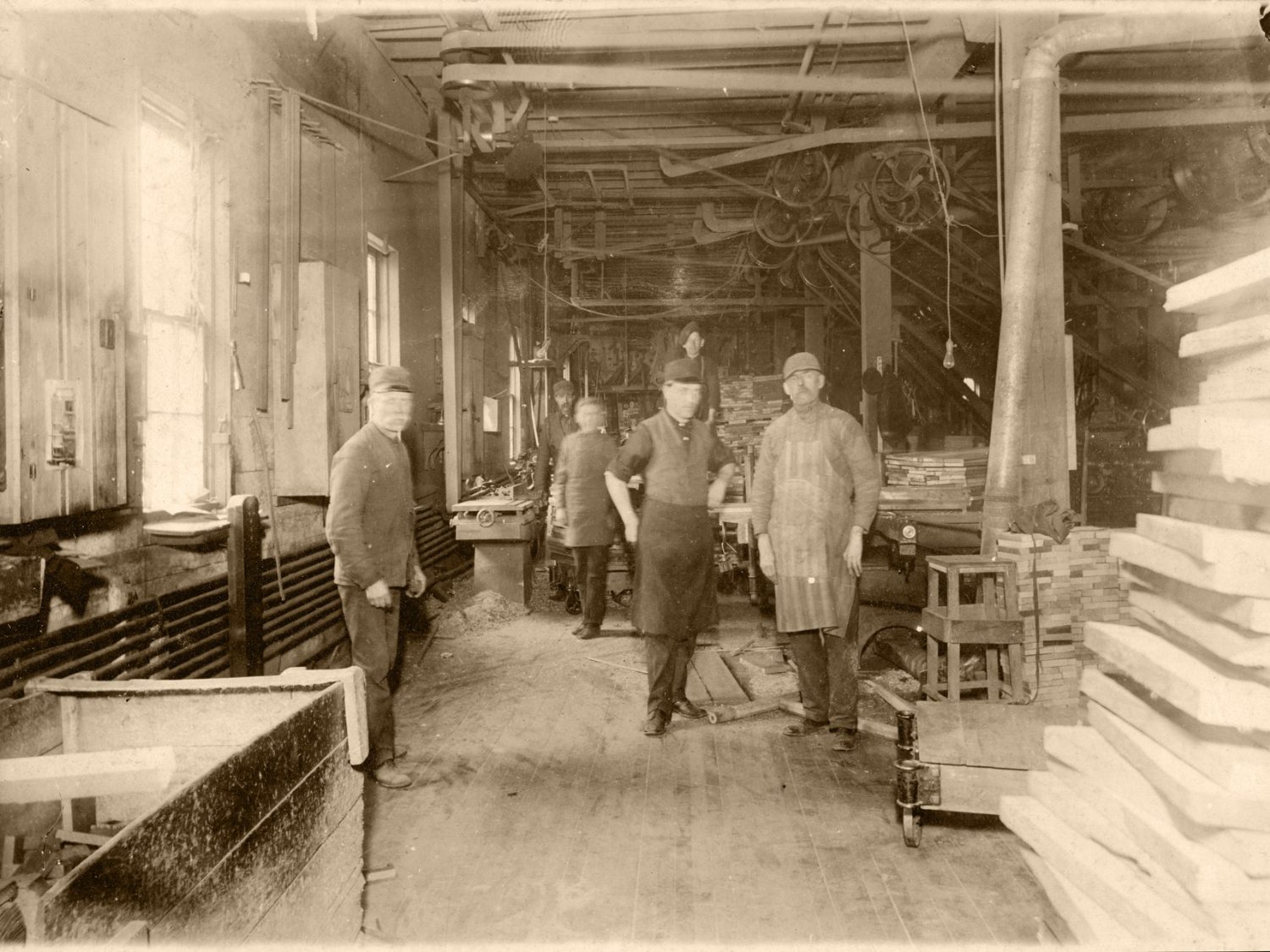 Historic photo of Rockford Standard Furniture craftsmen in the early 1900's